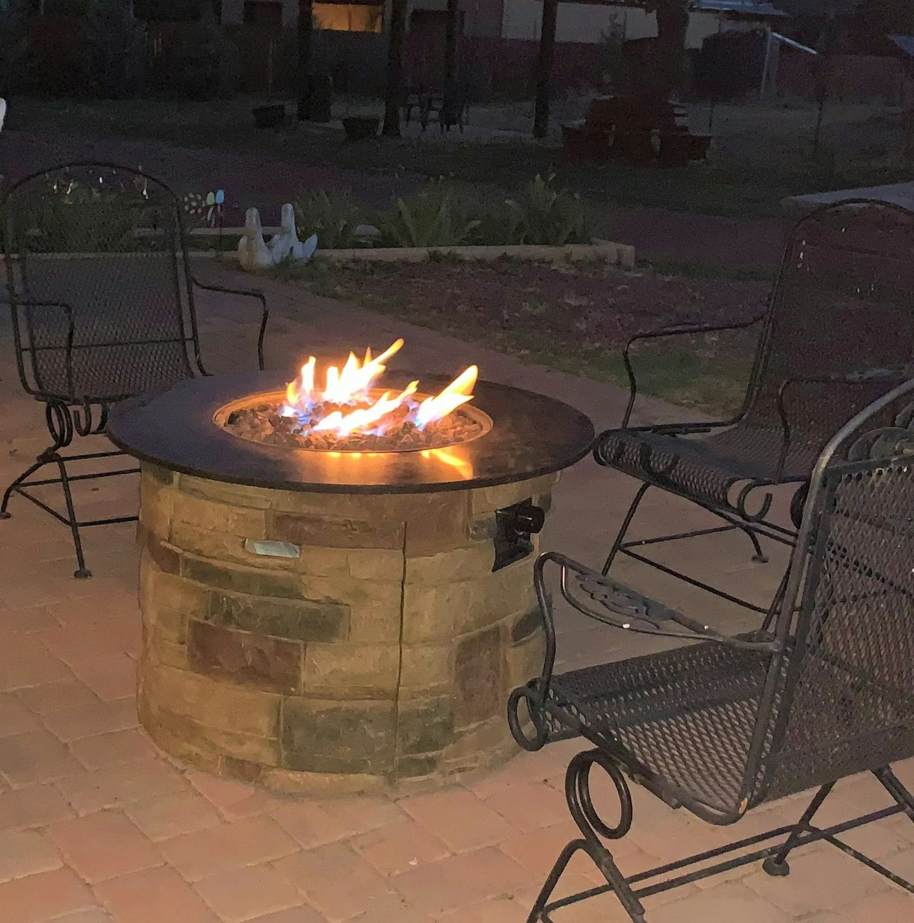 The shared firepit photographed at dusk